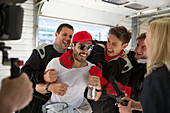 Formula one driver and team in repair garage