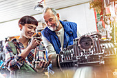 Motorcycle mechanics repairing engine