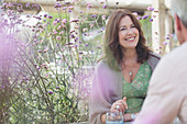 Smiling mature couple talking on patio