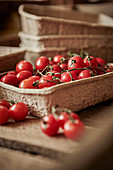 Fresh vine cherry tomatoes in container