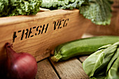Fresh vegetables and wooden crate