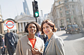 Businesswomen on urban street, London, UK
