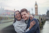Couple standing at Westminster Bridge, London, UK