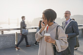 Silhouette businesswoman talking on cell phone