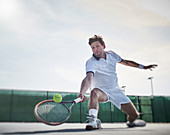 Determined tennis player playing tennis