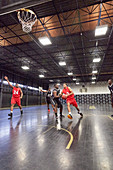 Young basketball players playing basketball