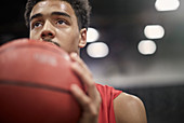 Close up basketball player holding basketball