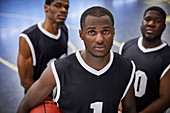 Portrait serious, focused basketball player team