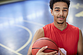 Portrait basketball player holding basketball
