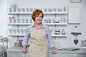 Portrait female business owner in art paint shop