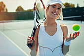 Portrait tennis player holding tennis racket