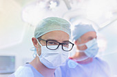 Surgeon wearing eyeglasses and surgical mask