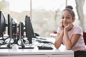 Portrait girl student researching at computer