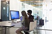 Students programming at computer