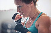 Close up determined, boxer shadowboxing