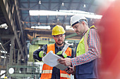Male foreman and worker talking