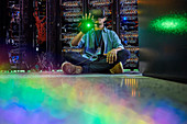 Male computer programmer using VR glasses