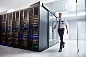 Male security guard walking in server room