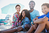 Portrait happy multi-ethnic family on summer beach