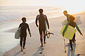 Multi-ethnic family and boogie boards
