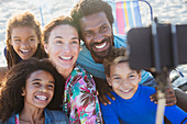 Smiling, happy family taking selfie