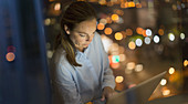 Businesswoman working late at laptop