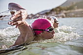 Determined female swimmer swimming