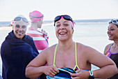 Portrait female swimmers drying off with towels