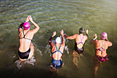 Overhead view female swimmers swimming