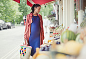 Pregnant woman shopping for produce