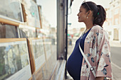Pregnant woman browsing real estate listings