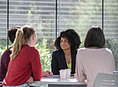 Businesswomen talking, planning in meeting