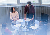 Businessman leading conference room meeting