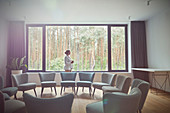 Pensive woman in group therapy room