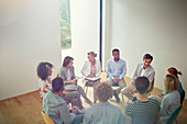 People talking in a circle in group therapy