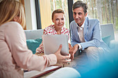 Therapist showing tablet to couple