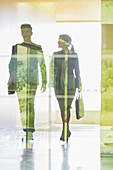 Silhouette business people walking corridor