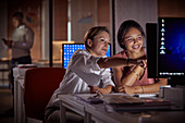Female businesswomen working late at computer