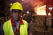 Portrait serious steelworker in steel mill