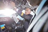 Male pilot in airplane cockpit