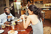 Couple eating breakfast at table