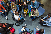 Overhead view speaker in wheelchair talking