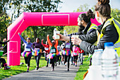 Volunteers with water ready for runners