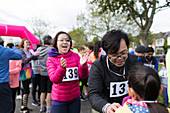 Family runners at charity run in park
