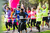 Enthusiastic runners cheering and running