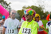 Playful runner in wig at charity run in park