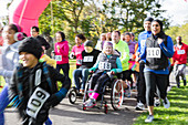 Runners and people in wheelchairs