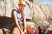 Portrait smiling, confident female rock climbers