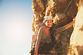 Portrait smiling, confident female rock climber