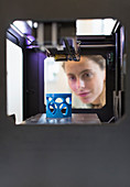 Female designer using 3D printer